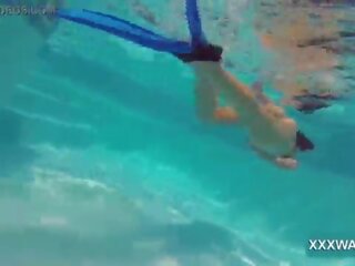 Groovy brunette hooker Candy swims underwater